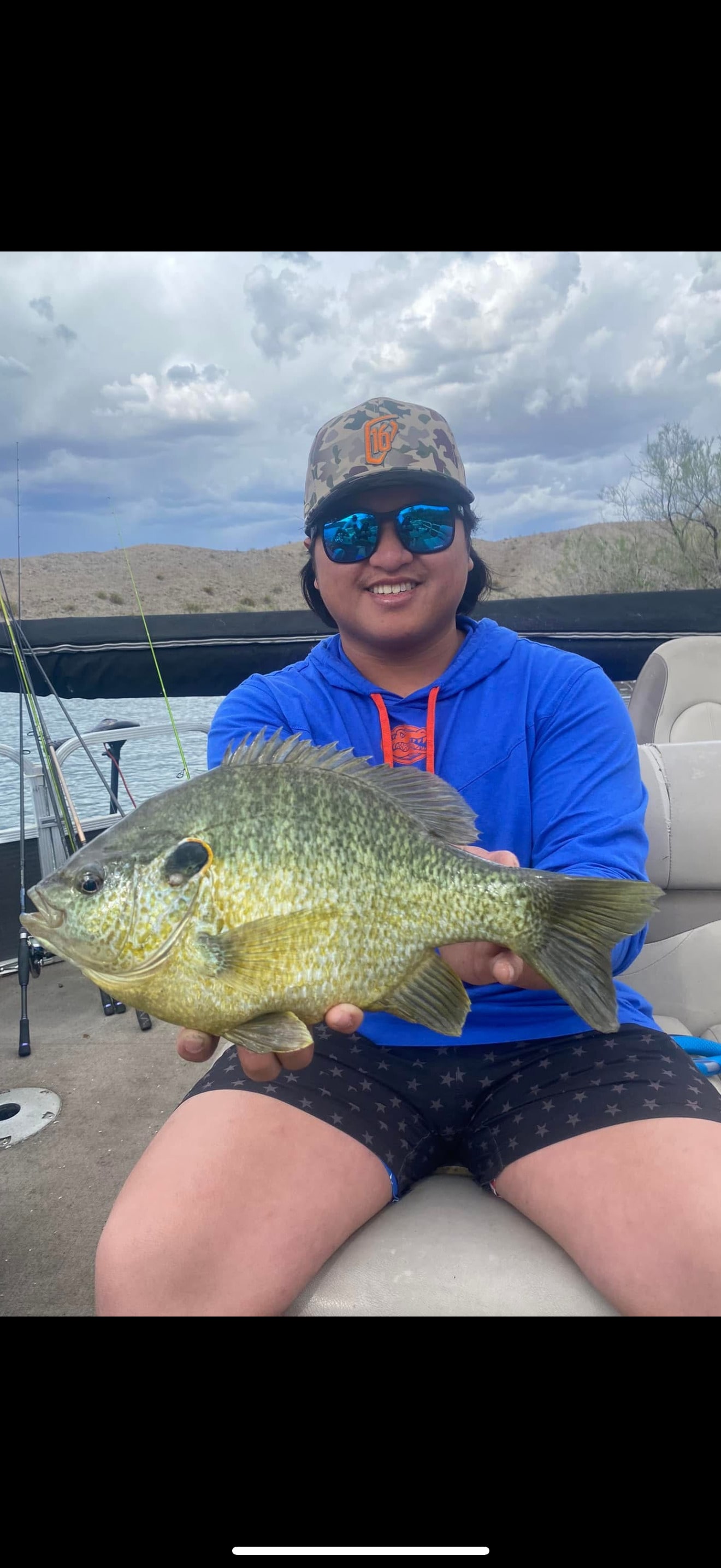 Angler holding a large panfish on Lake Havasu